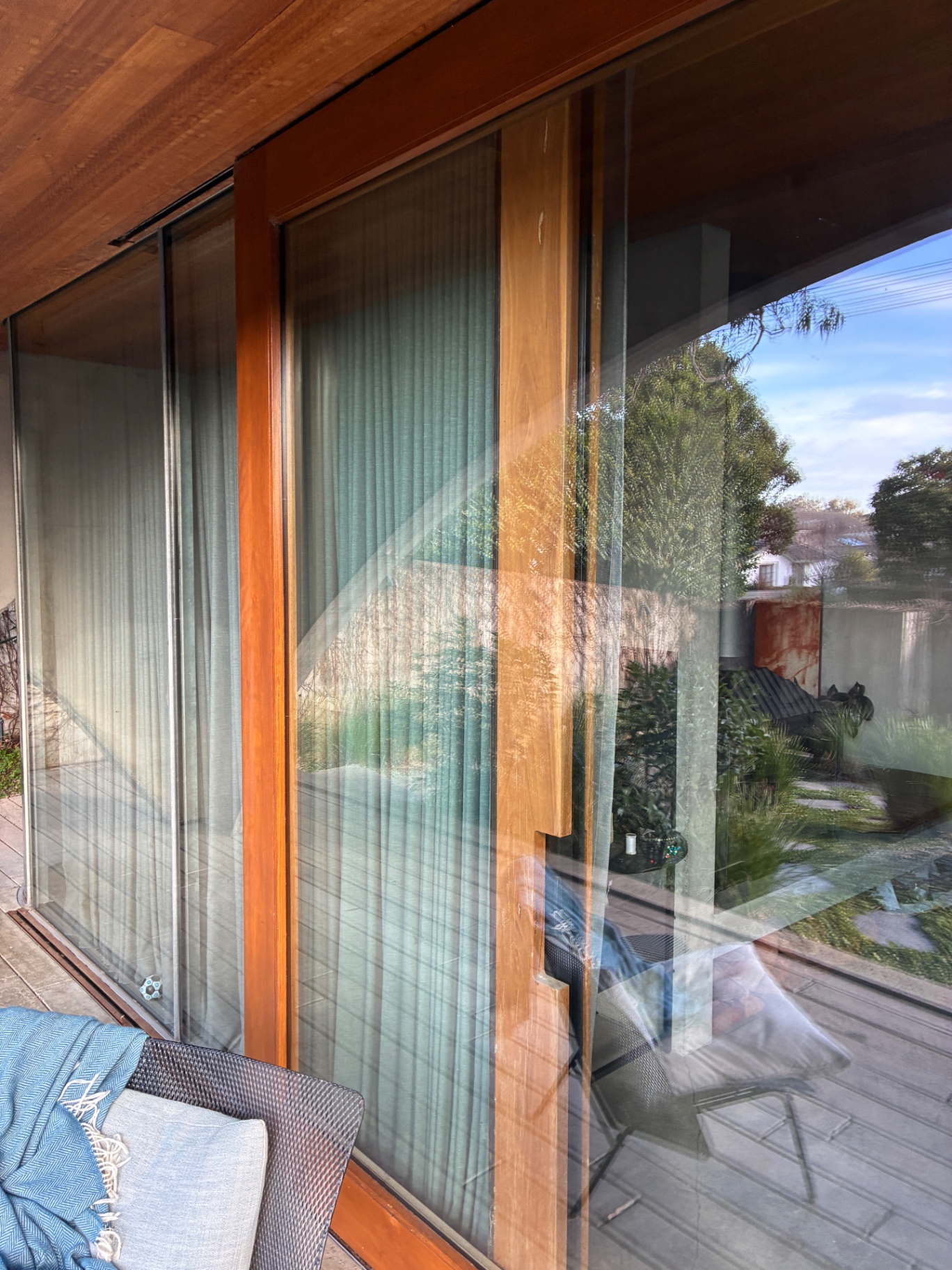 Timber-framed exterior glazing cleaned with clear garden reflections in Hawthorn House in Hawthorn East, Victoria — Bluewater Pressure Washing