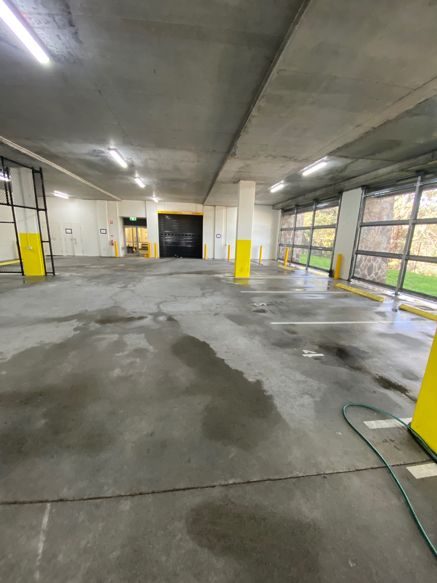 Concrete carpark floor washed down between the bollards in Moorabbin, Victoria — Bluewater Pressure Washing